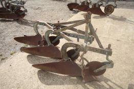 Ferguson 3 furrow plough. With discs and skimmers. No badge.