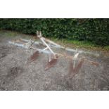 Shallow ridger mounted on Ferguson toolbar. No badge.