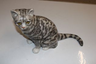 A Winstanley pottery model of cat with glass eyes