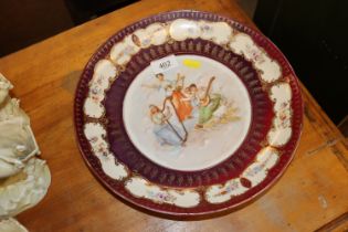 A Continental porcelain shallow dish decorated wit