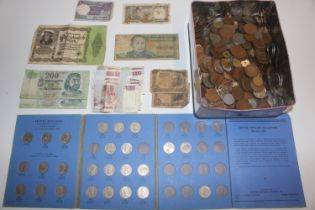 A tin of various coinage and bank notes