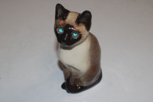 A Winstanley pottery model of cat with glass eyes