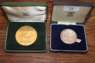 A 1969 silver Welsh coin in case; and another 1969