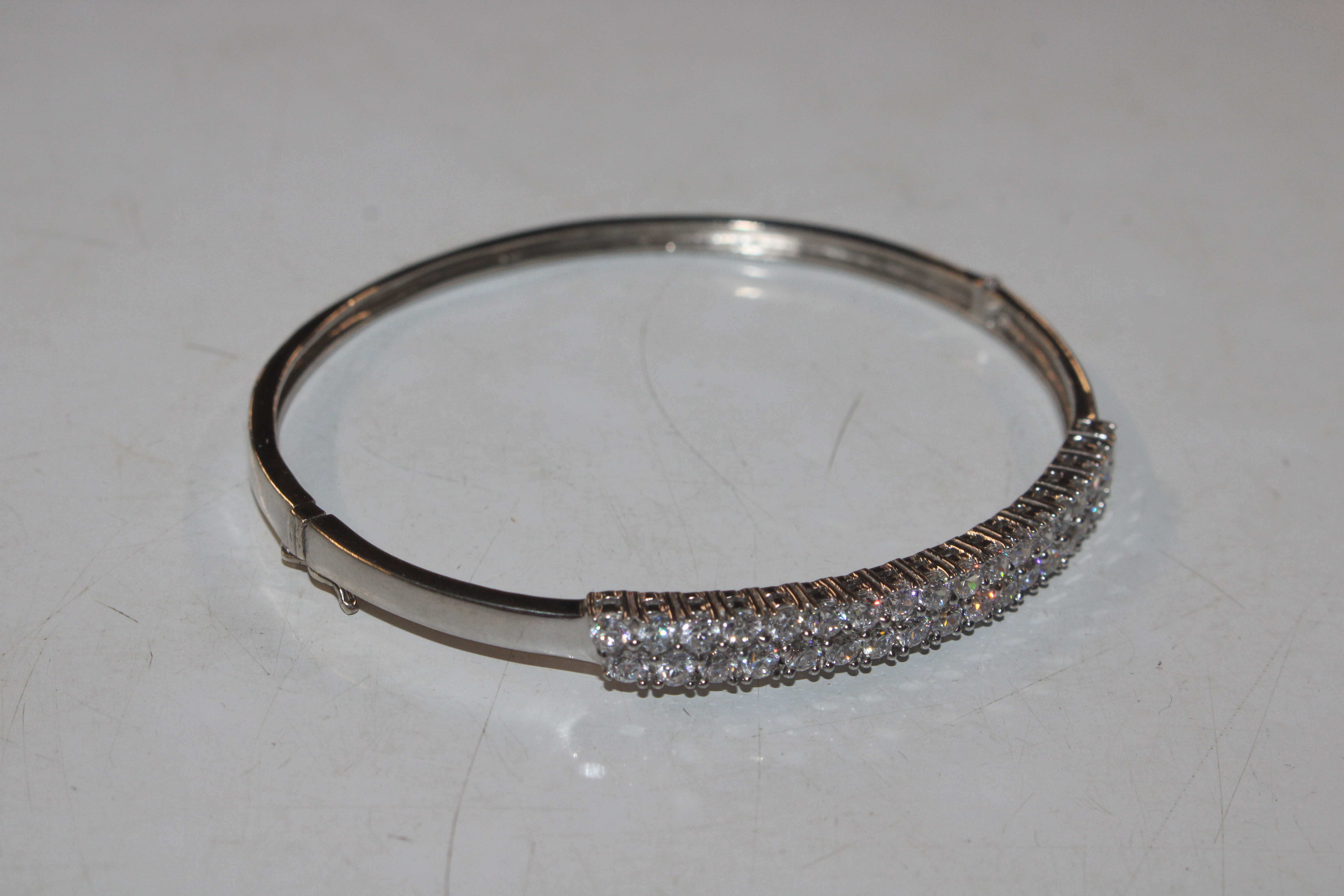 A Sterling silver bangle with double row of Cubic