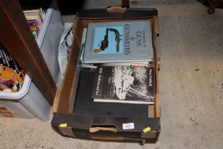 A box of military reference books
