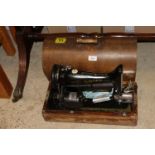 A vintage Singer electric sewing machine, sold as