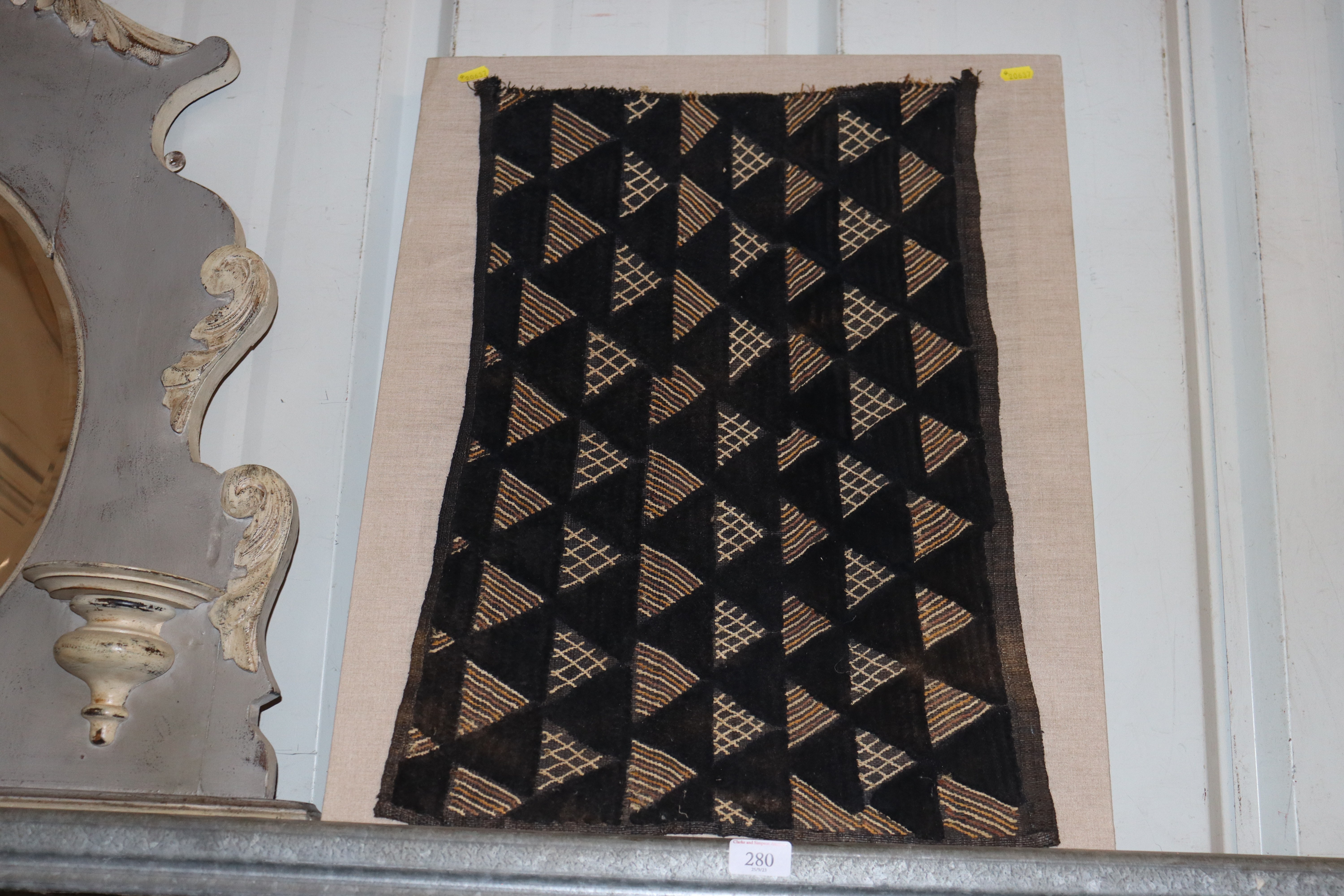 A Kuba cloth mounted onboard