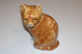 A Winstanley pottery model of cat with glass eyes