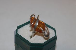 A large modernist Sterling silver and amber ring,