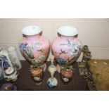 A pair of Victorian opaque glass vases decorated w