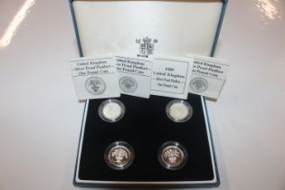 A cased set of four silver proof £1 coins with cer