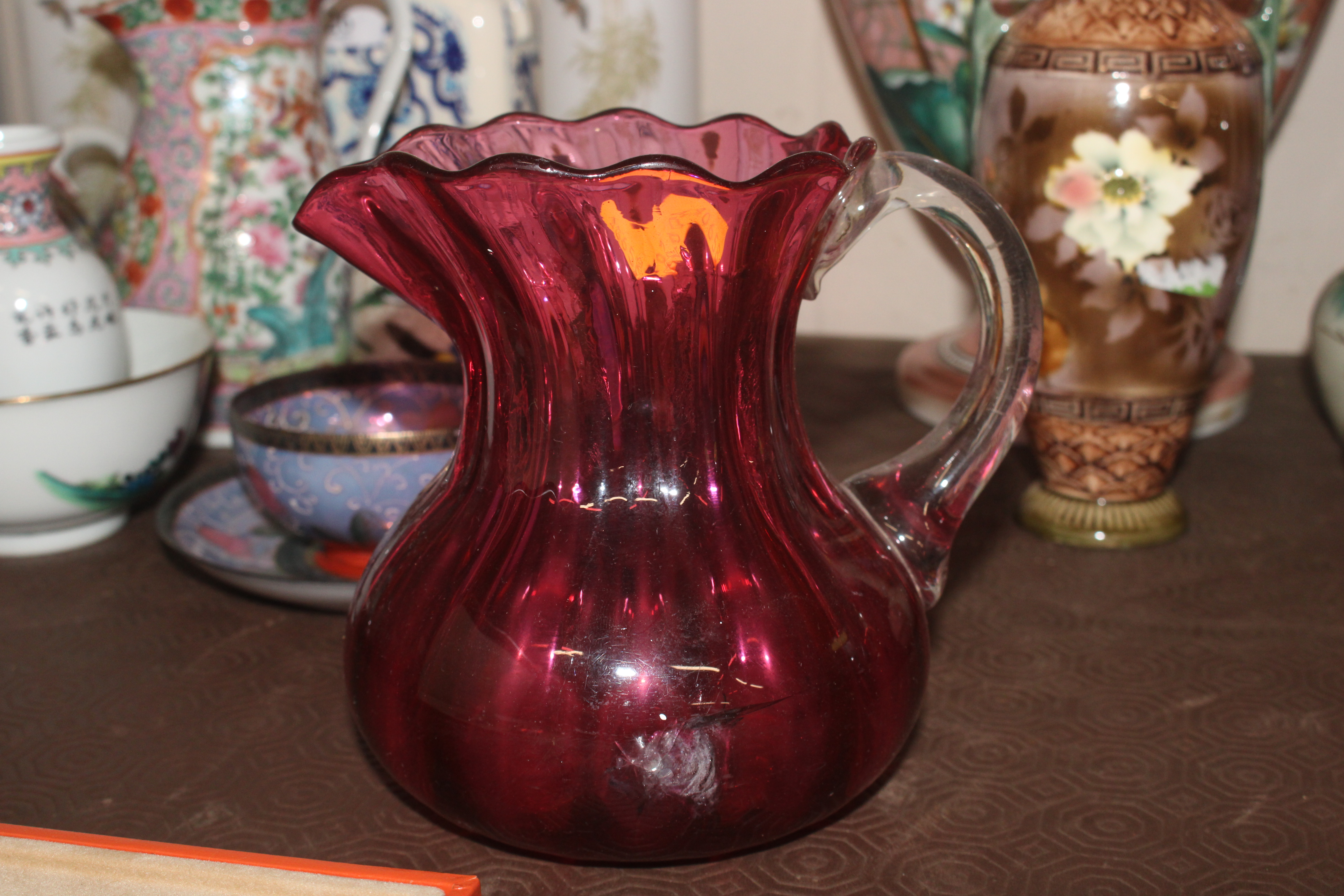 A cranberry glass jug with gilt mount; an etched c - Image 2 of 4