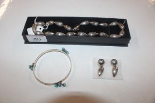 A 925 silver bangle with turquoise coloured stones