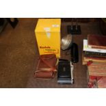 A Kodak camera and flash
