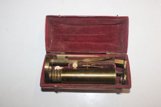 A vintage boxed microscope
