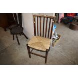 An Arts & Crafts slat back chair