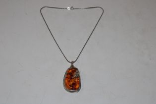 A large Sterling silver and amber Art Nouveau styl