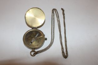 A brass cased compass