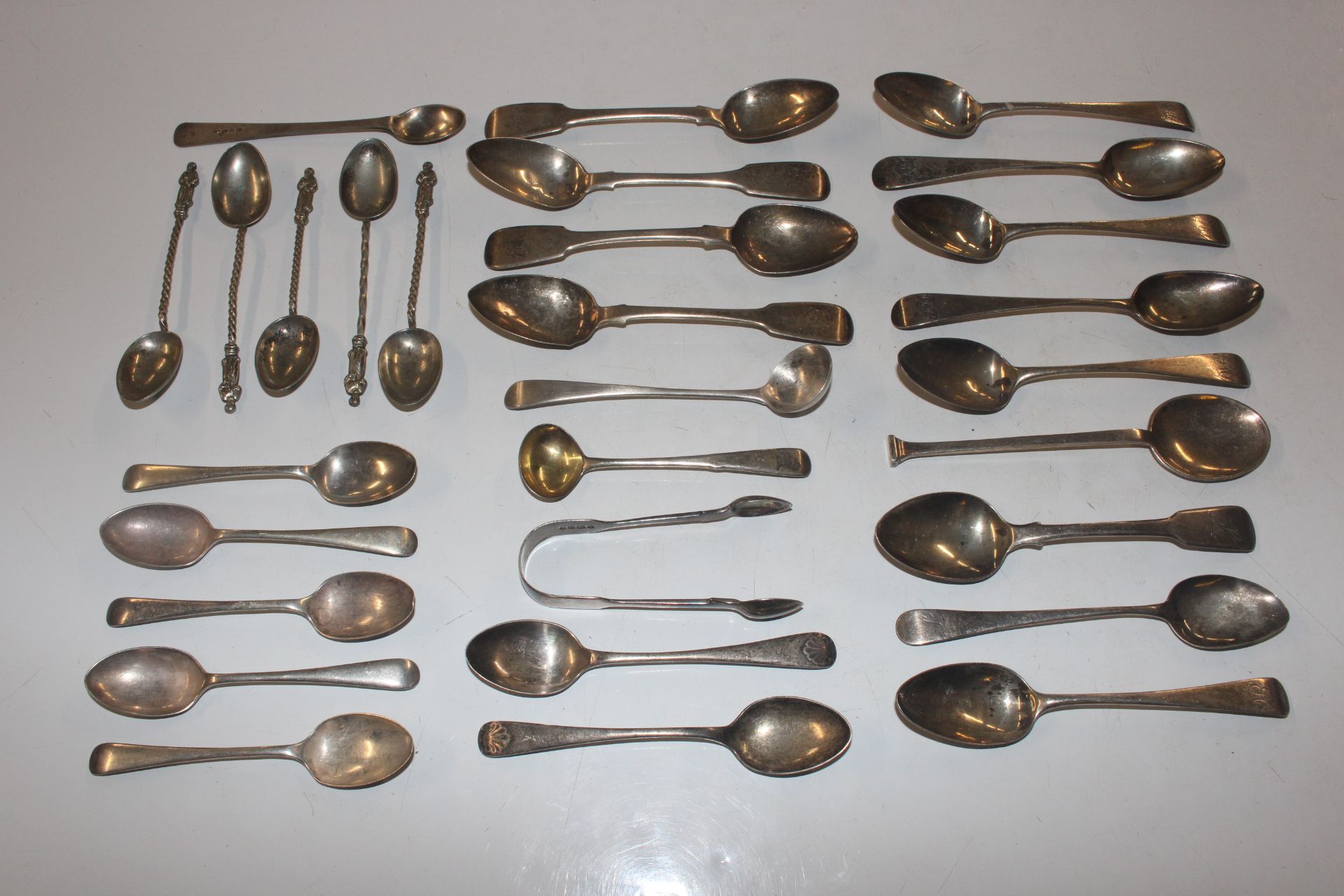 A bag of silver cutlery, mainly teaspoons and suga