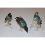 A Karl Ens porcelain model of a parrot and two oth