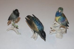 A Karl Ens porcelain model of a parrot and two oth