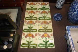 Eight Art Nouveau floral decorated tiles, approx.