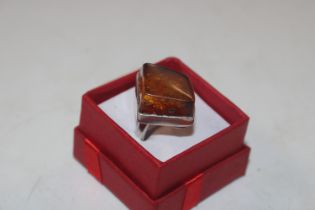 A large Sterling silver and amber ring, ring size