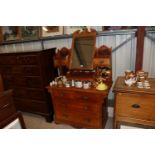 A late Victorian satin walnut dressing chest with