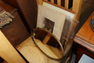 A gilt framed oval mirror; picture frame; Thomas G