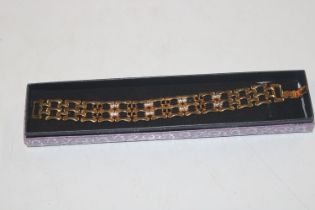 A Napier costume bracelet set with white and black
