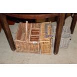 Two wicker bottle carriers and a wicker picnic bas