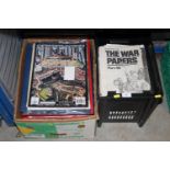 Two boxes containing commemorative newspapers