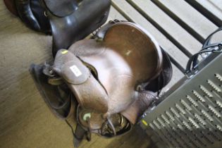 An ornate Western style horse riding saddle with handle