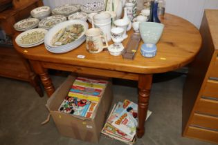 An oval pine kitchen table