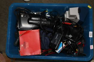 A box of various camera equipment and accessories