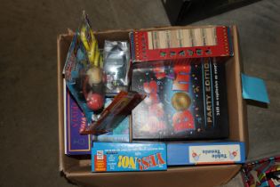 A box of toys and games, including Star Wars