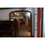 A large red and gilt framed over-mantel mirror