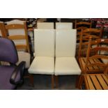 A set of four leatherette upholstered dining chair