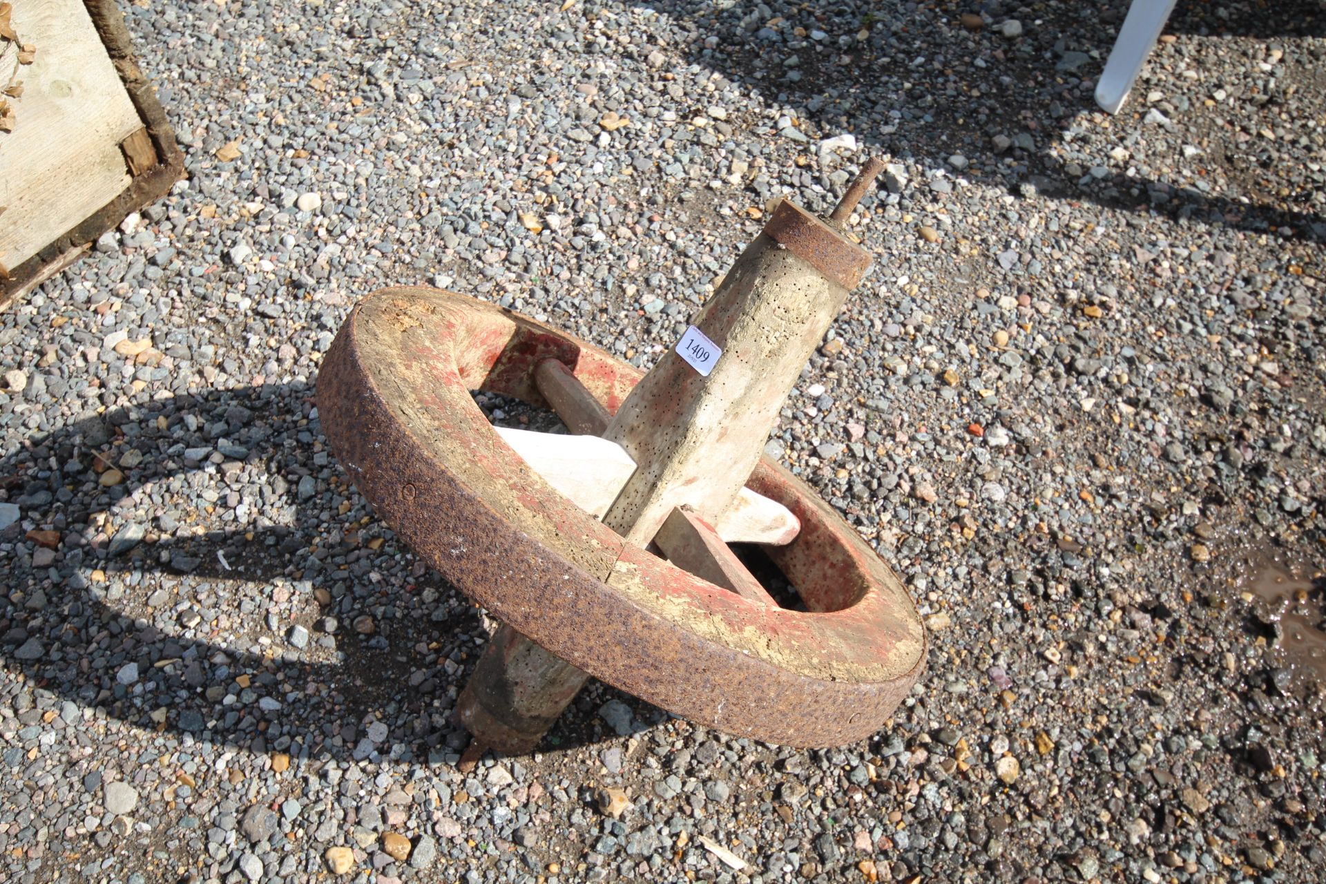 A vintage wheelbarrows wheel