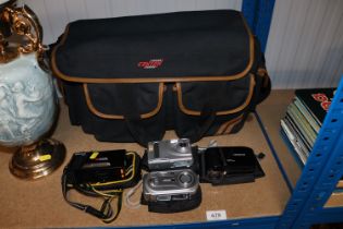 A camera case and four various cameras