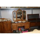 A French style light oak dressing table with tripl