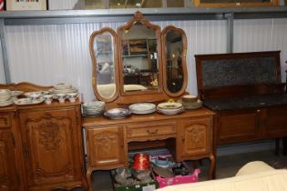 A French style light oak dressing table with tripl