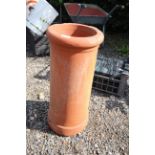 A terracotta chimney pot