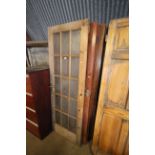 Four partly glazed wooden doors and two wooden fir