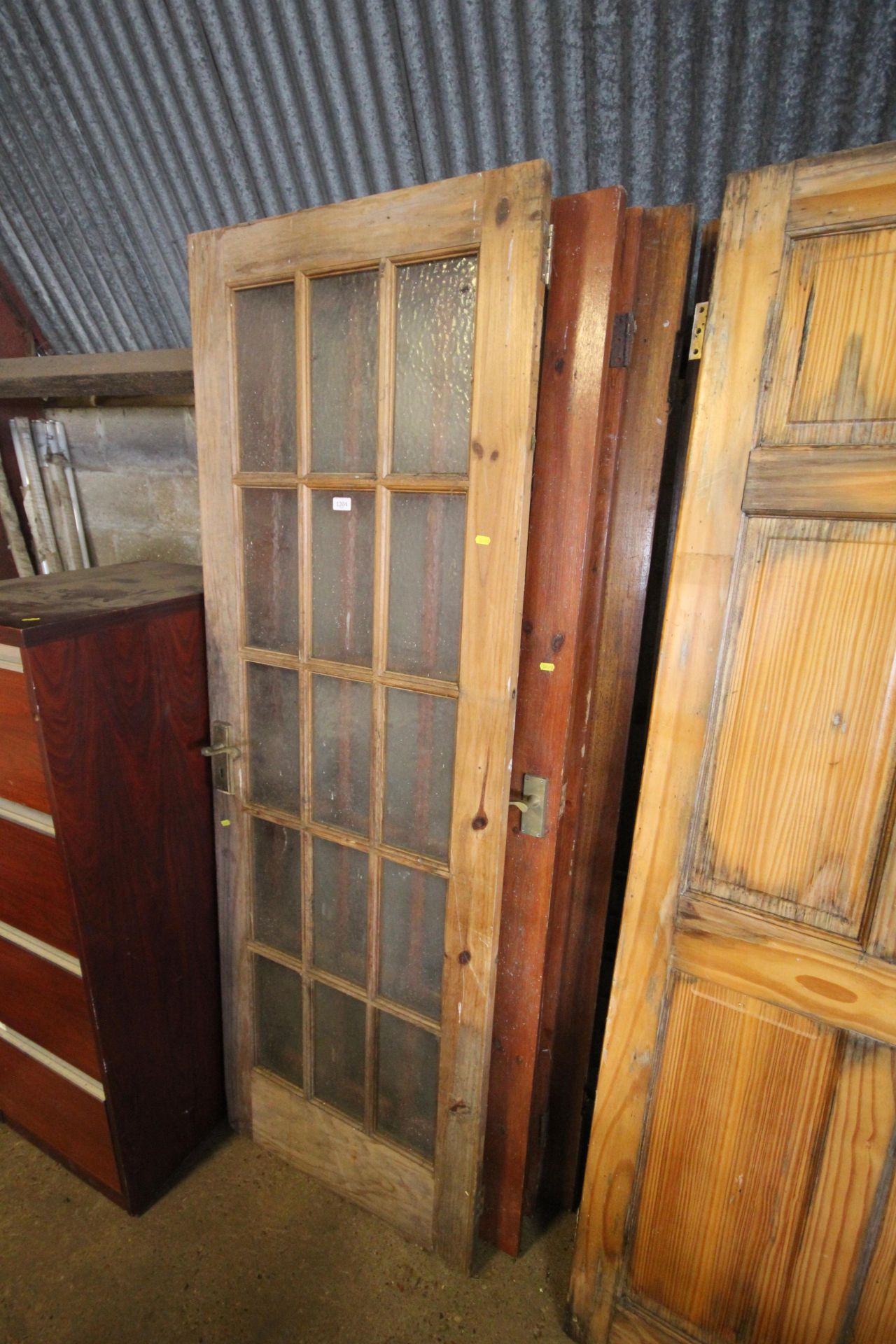 Four partly glazed wooden doors and two wooden fir