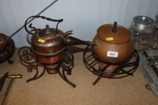 A decorative copper kettle on wrought iron spirit