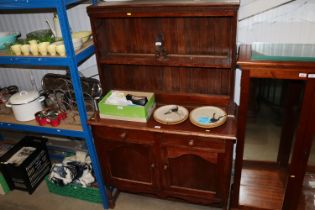 An oak dresser raised on cupboard base