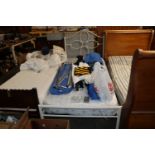A metal single bed frame and Sleep Tight mattress
