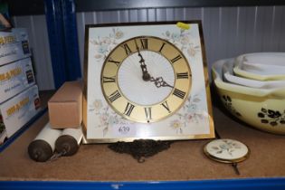 A floral decorated wall clock