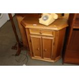 A light oak hall cupboard fitted single drawer